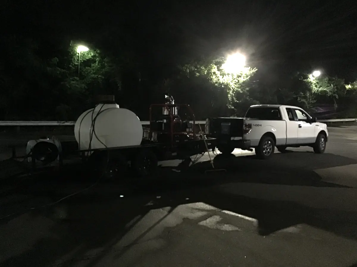 4 Seasons truck and washing equipment at a commercial property after dark