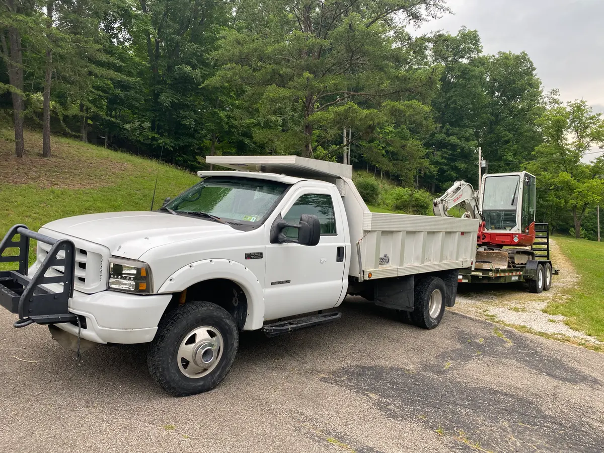 4 Seasons dump truck and equipment trailer