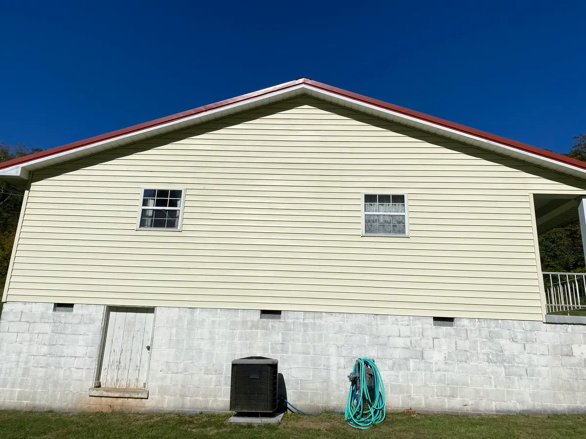 The same residential siding after pressure washing